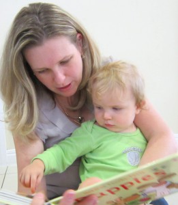 speech pathologist reading with baby
